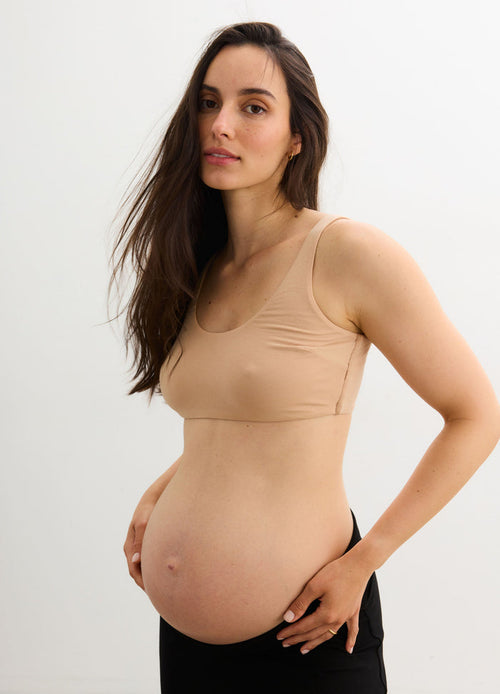 The Skin To Skin Bra - Sand-colored maternity bra with seamless design and wide straps, ideal for pregnancy, nursing, and postpartum.