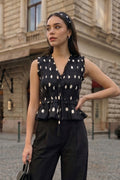 Black polka peplum top