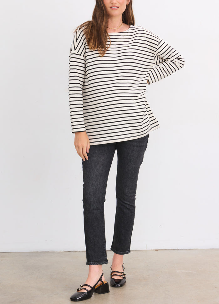 Striped black and white maternity top with 3/4 sleeves and relaxed fit.