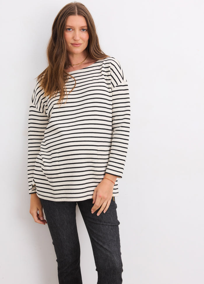 Striped black and white maternity bateau top with 3/4 sleeves and relaxed fit.