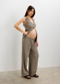 Light brown ribbed maternity pants with a relaxed wide-leg fit, worn with a matching sleeveless crop top.