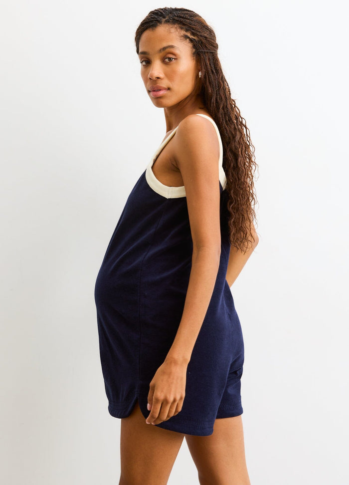 The Izzy Romper - Navy maternity romper with cream trim, sleeveless design, loose fit for pregnancy, nursing, and postpartum comfort.
