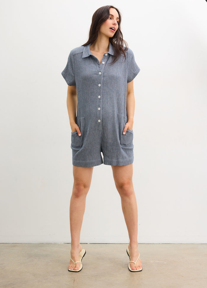 The Lenora Romper - Navy blue maternity romper with short sleeves, button-front, collar, and pockets for nursing and postpartum comfort.