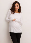 Pregnant woman wearing white maternity longsleeve tee with stretchy, soft fabric and scoop neckline.