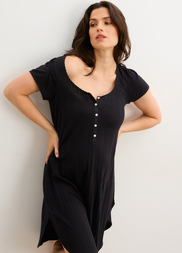 Black short-sleeve maternity nightgown with scoop neckline and front button details, soft fabric.