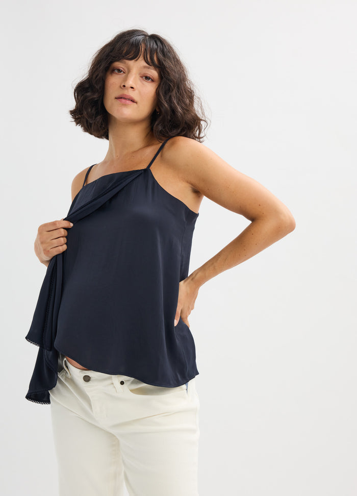 Navy blue satin maternity cami with delicate spaghetti straps and a loose, flowing fit.