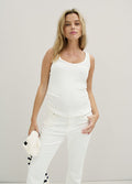 The Softest Rib Tank 2-Pack - White ribbed maternity tank top styled for nursing and postpartum comfort, paired with white pants.