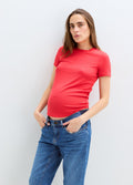 Coral pink ribbed short-sleeve maternity tee with fitted cut and crew neckline.