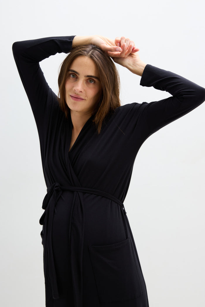 Black maternity robe with long sleeves, wrap style, and waist tie belt, designed for pregnancy comfort.