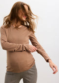 Mocha maternity long sleeve knit tee on pregnant model with fitted silhouette and soft texture.
