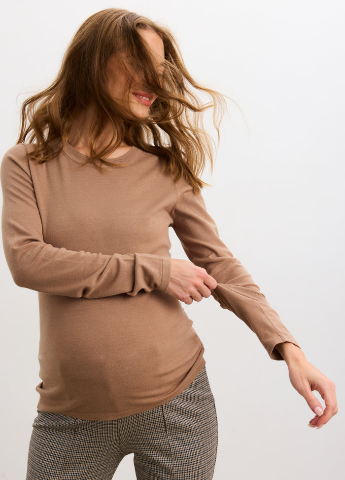 Mocha maternity long sleeve knit tee on pregnant model with fitted silhouette and soft texture.