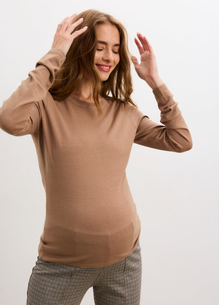 Mocha knit long sleeve maternity tee with fitted silhouette worn by pregnant woman.