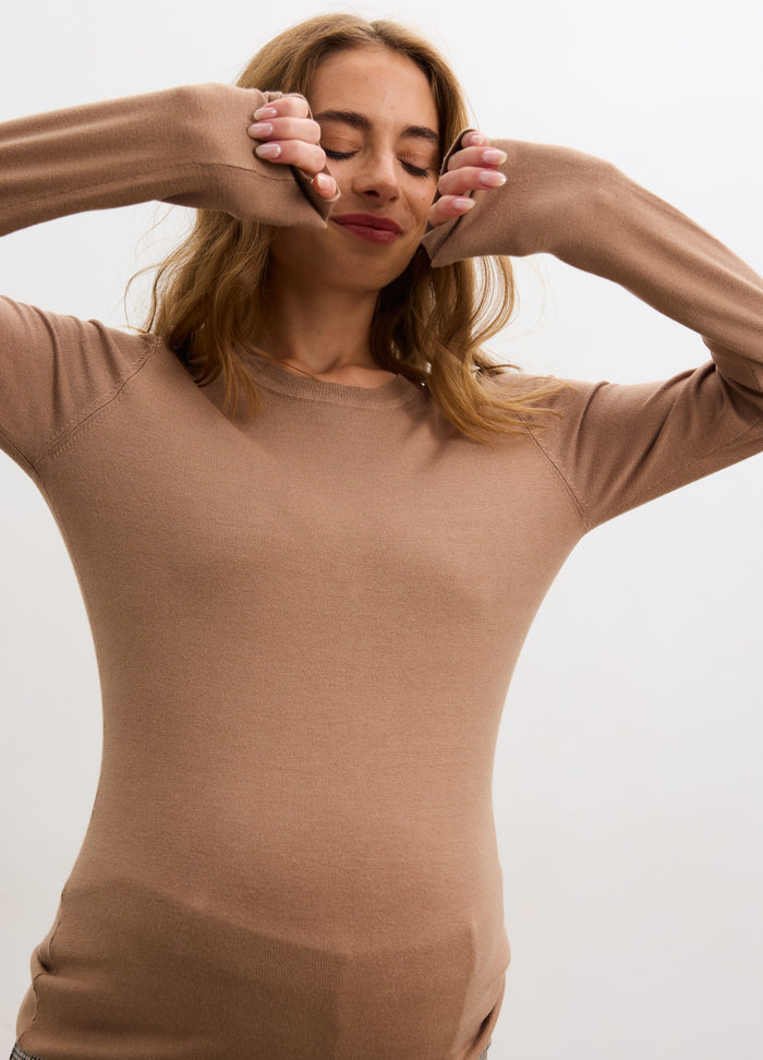 Light brown ribbed knit long sleeve maternity tee with fitted silhouette and round neckline.