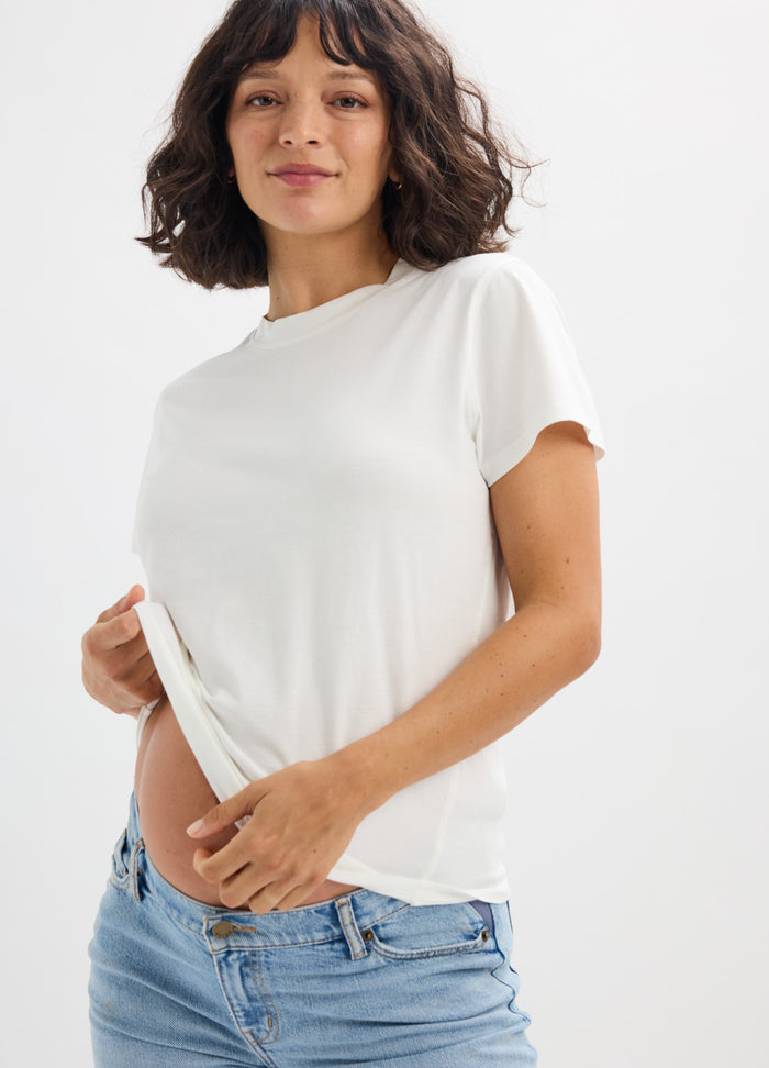 White washed cotton short sleeve crewneck maternity tee with relaxed fit and soft texture.